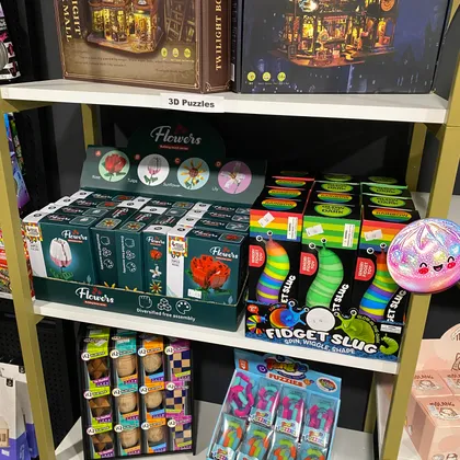 Shelf of sensory fidget toys, including fidget slugs and squishies, at Mindspace Toys.